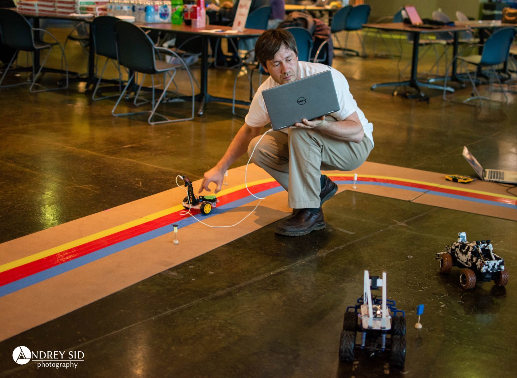 Detroit Autonomous Vehicle Group founder Alex Polonsky with an autonomous RC car during AutoSens at the Michigan Science Center.