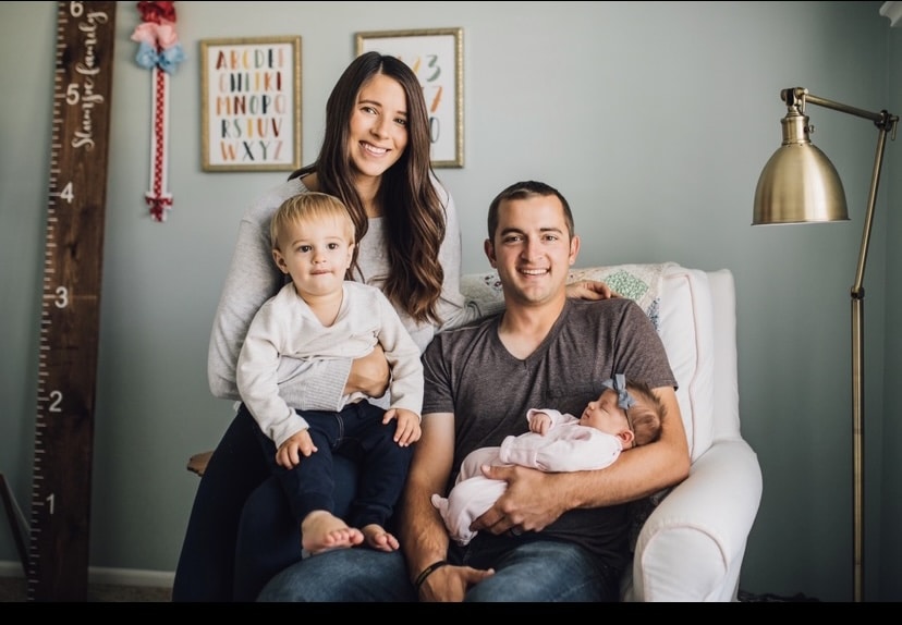 Kelly Suntrup Stumpe, aka The Car Mom, with husband Tyler and kids George (almost two) and Hattie (five months).